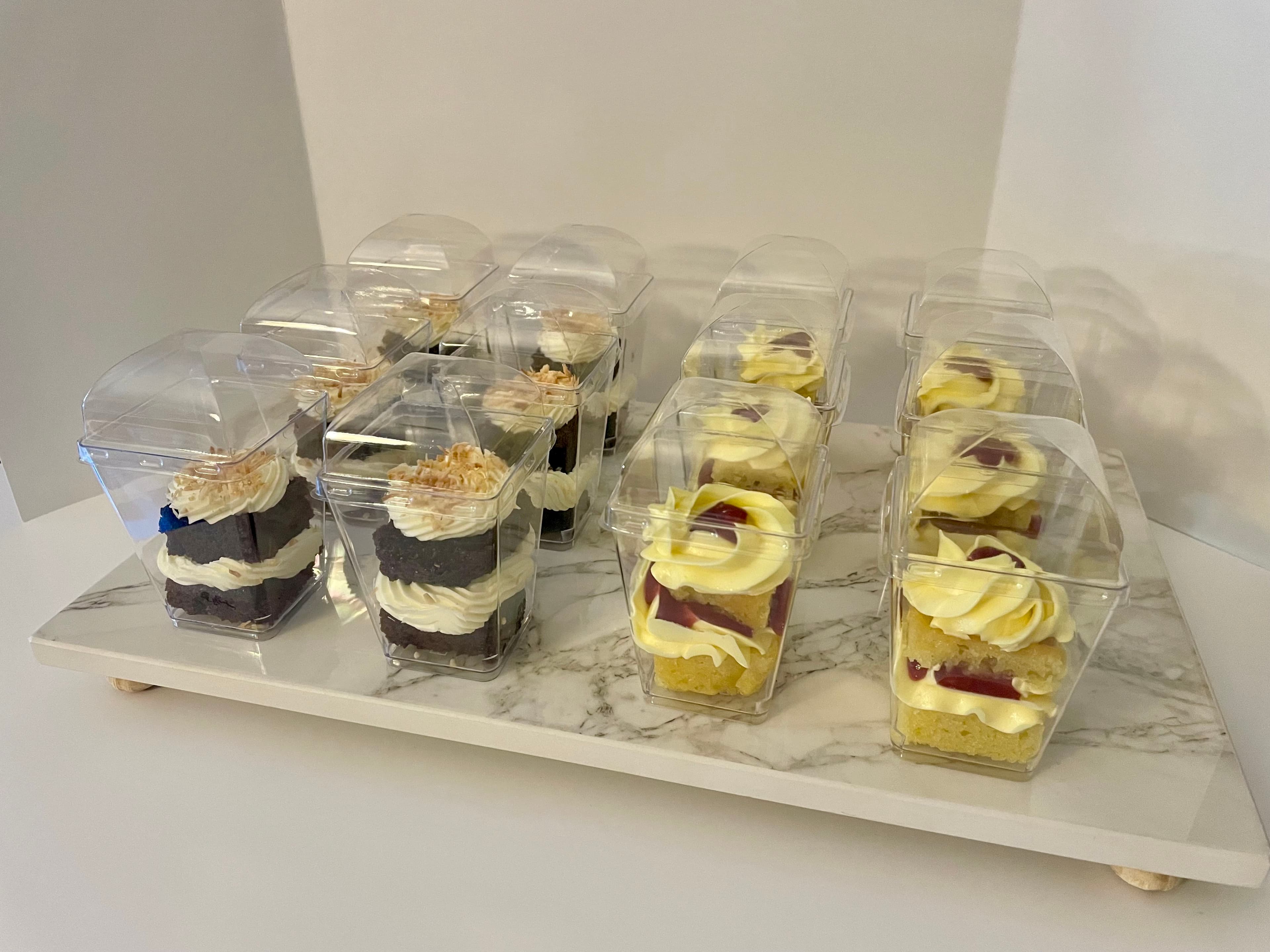 Custom cake shooters arranged on a serving tray